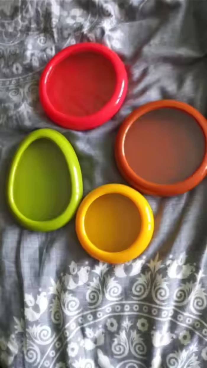 All four pods laid out on a patterned cloth