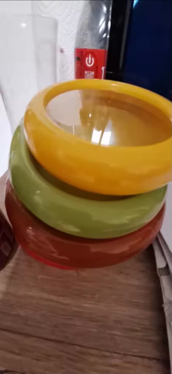 Three pods stacked on a kitchen worktop